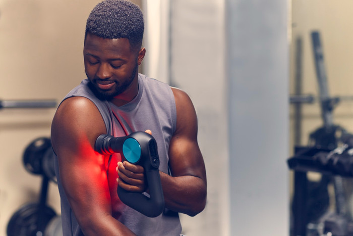 Theragun Pro + product in use