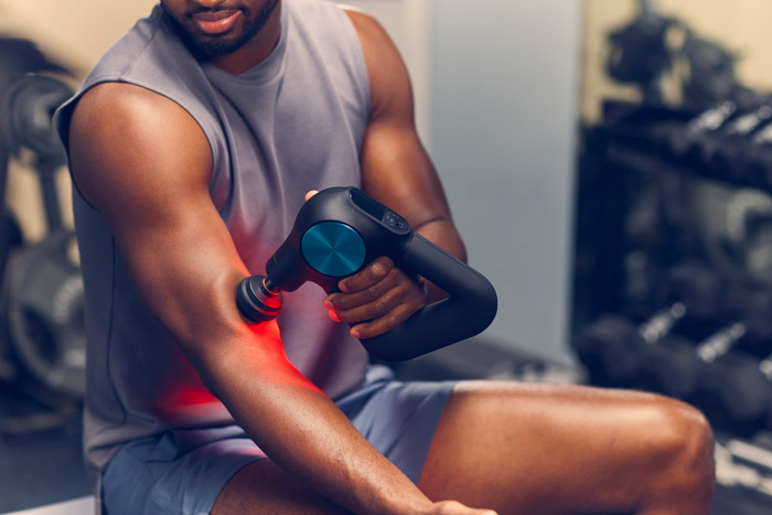 Theragun Pro + product in use