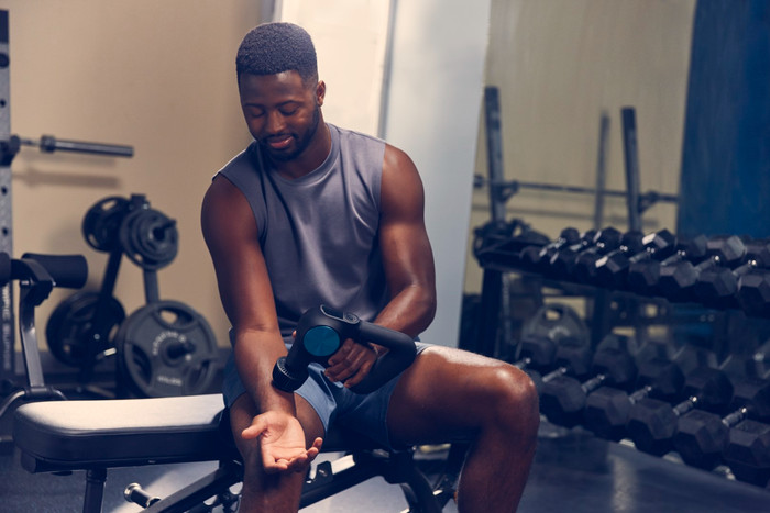 Theragun Pro + product in use