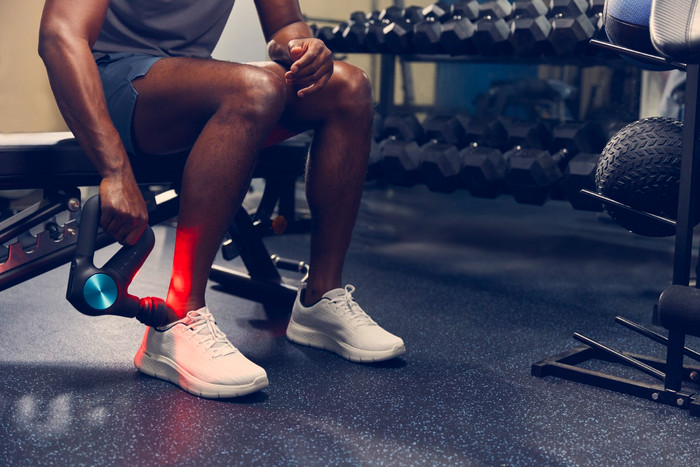 Theragun Pro + product in use