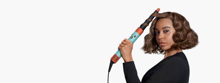 Dyson Airwrap i.d. Curly + Coily Red Velvet/Gold product in use