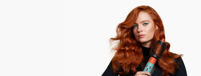 Dyson Airwrap i.d. Curly + Coily Red Velvet/Gold product in use