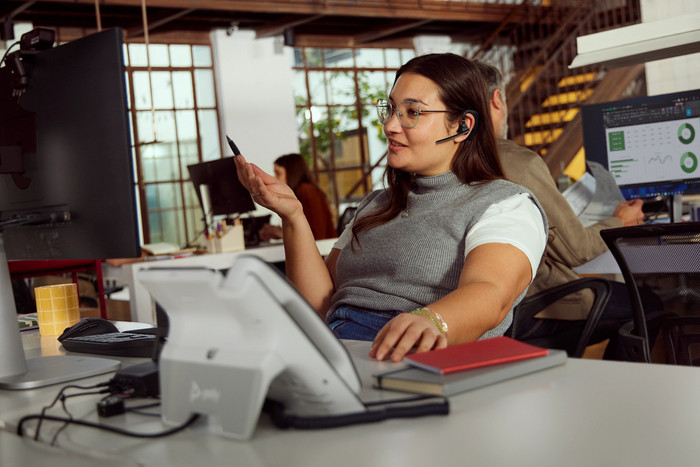 Poly Voyager Legend 50-M UC Bluetooth Headset + Charging Case product in use