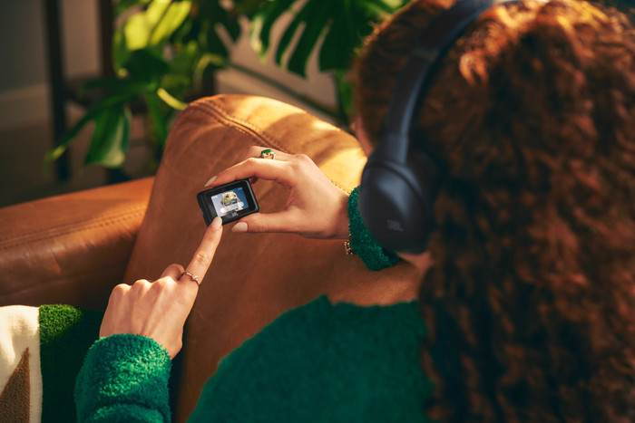 JBL Tour One M3 Smart TX Blue product in use