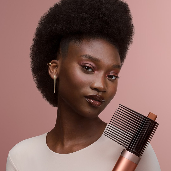 Dyson Airwrap Co-anda 2x Curly + Coily Limited Edition Amber Silk product in use