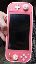 Nintendo Switch Lite Coral + Animal Crossing + 12 months of Nintendo Switch Online (Image 2 of 4)