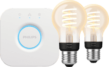 Philips Hue Filament White Ambiance Standaard 2-Pack + Bridge Philips Hue Filament White Ambiance