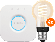 Philips Hue Filament White Ambiance Standard Lot de 4 + Bridge Kit de démarrage pour ampoules connectées