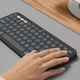 Logitech Pebble Keyboard 2 - K380s Graphite AZERTY product in use