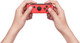 Nintendo Switch Joy-Con Set Red/Blue + Nintendo Switch Joy-Con Charge Grip product in use